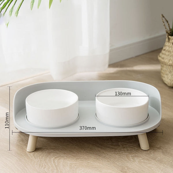  Dual elevated feeding bowl in white.